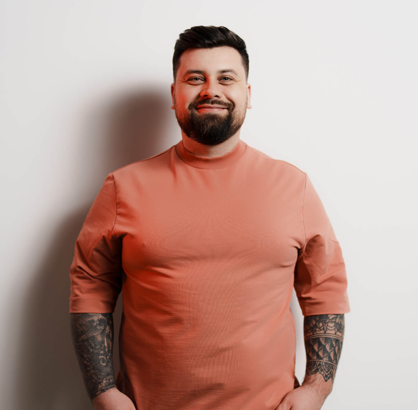 positive-plump-man-smiling-at-camera-against-white-2023-11-27-05-23-14-utc 1 (2) (1)