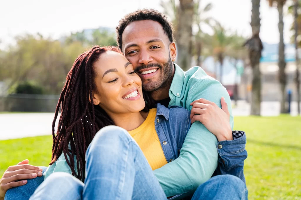 happy hispanic latino couple dating outdoors utc