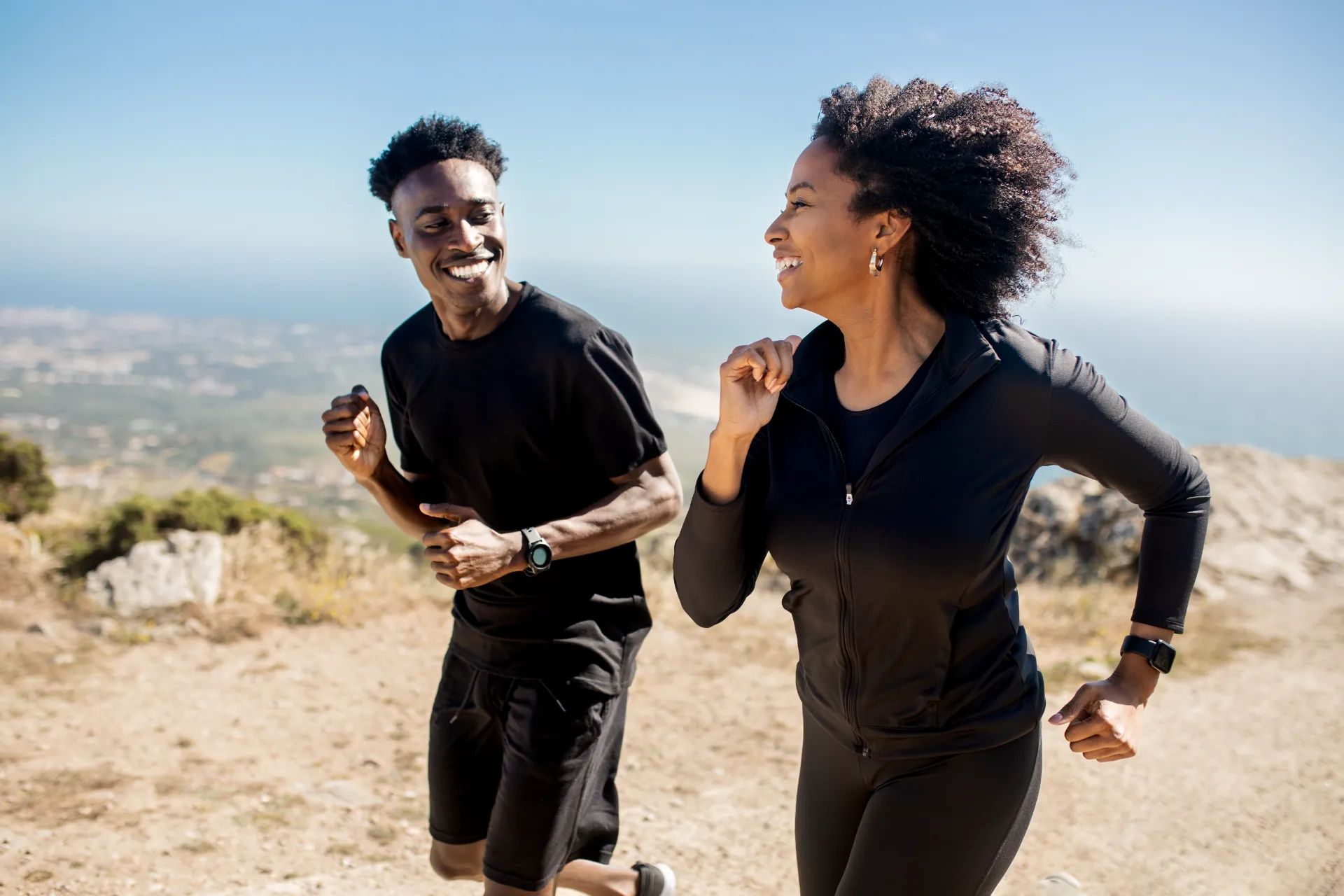 happy young african american couple in sportswear utc