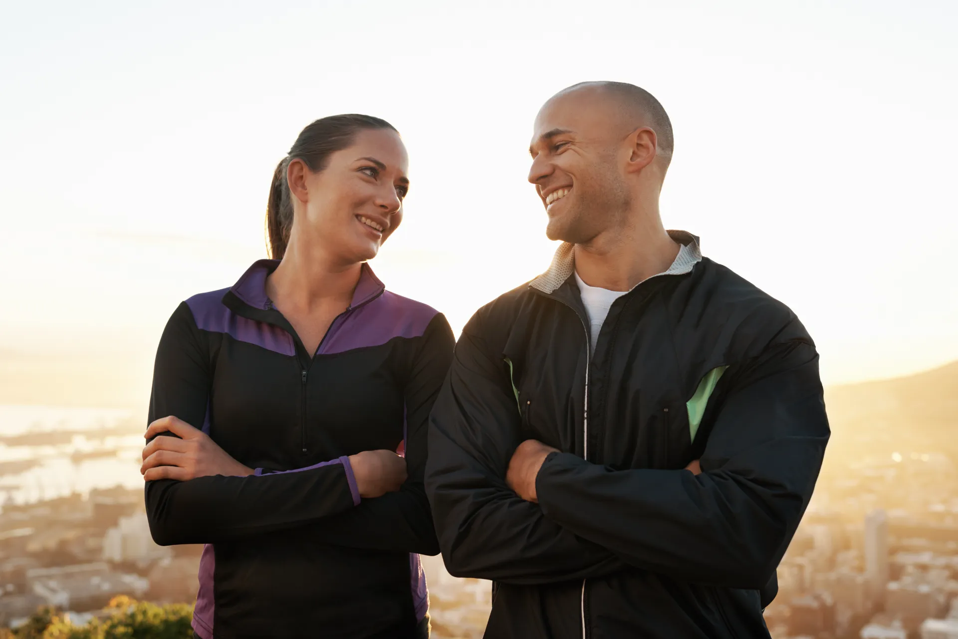 shot of a sporty young couple exercising outdoors utc