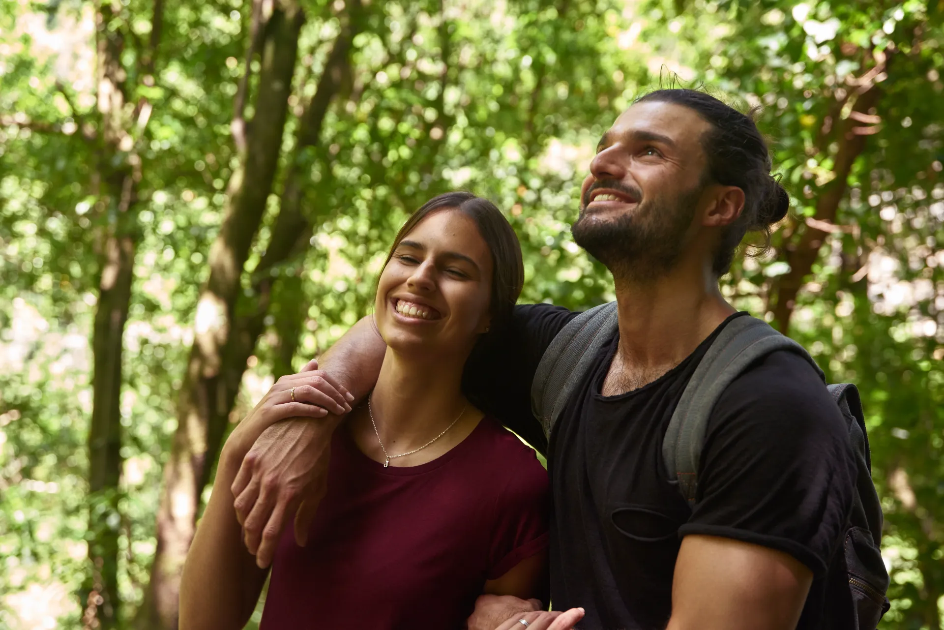 young couple holding each other and smiling as the utc